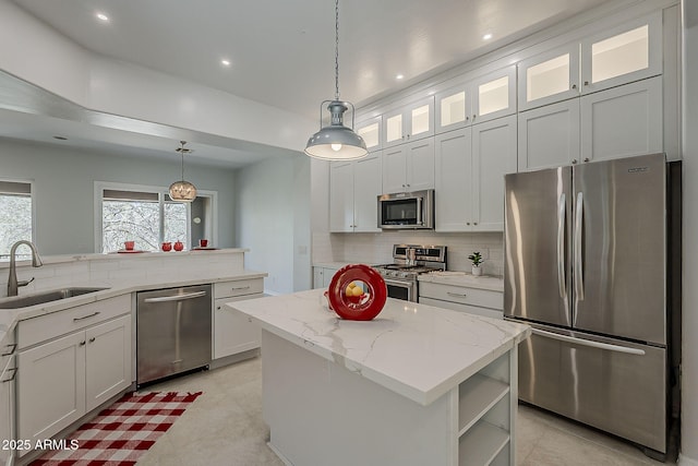 11752 N 135th Pl, Scottsdale, AZ 85259 - kitchen with decorative backsplash, appliances with stainless steel finishes, a sink, and a kitchen island
