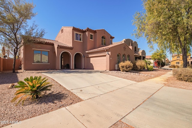 mediterranean / spanish-style house featuring a garage