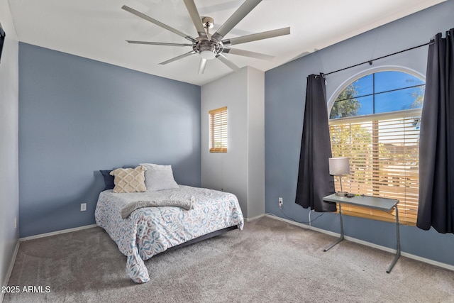 bedroom with multiple windows, carpet floors, and ceiling fan