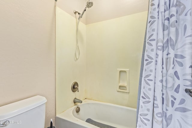 bathroom with shower / bathtub combination with curtain and toilet