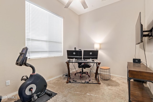 carpeted office space featuring ceiling fan and a wealth of natural light