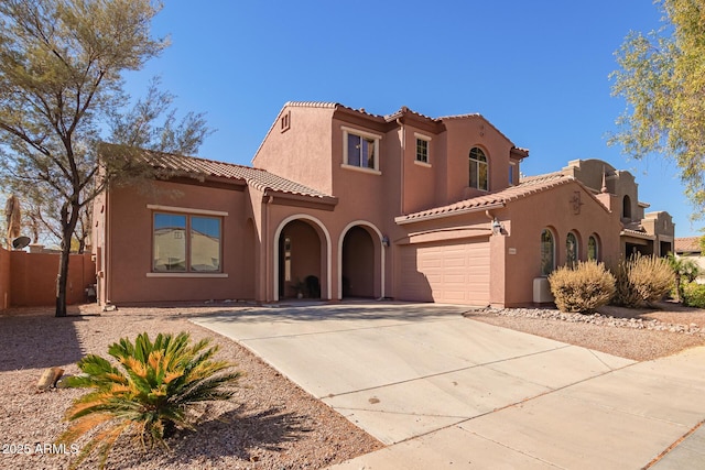 mediterranean / spanish-style house featuring a garage