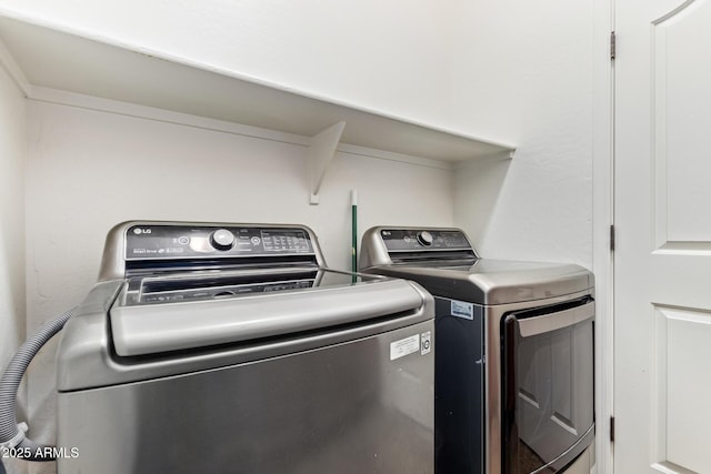 laundry area with separate washer and dryer