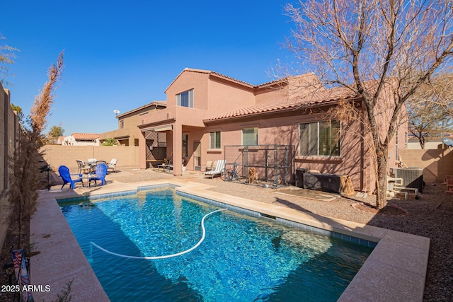 view of swimming pool with central AC and a patio area