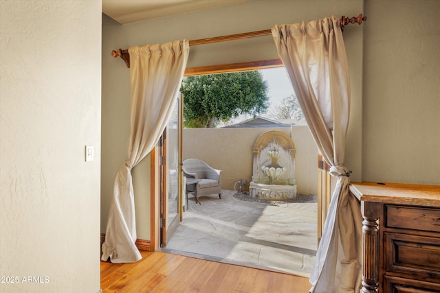 sitting room with light hardwood / wood-style flooring