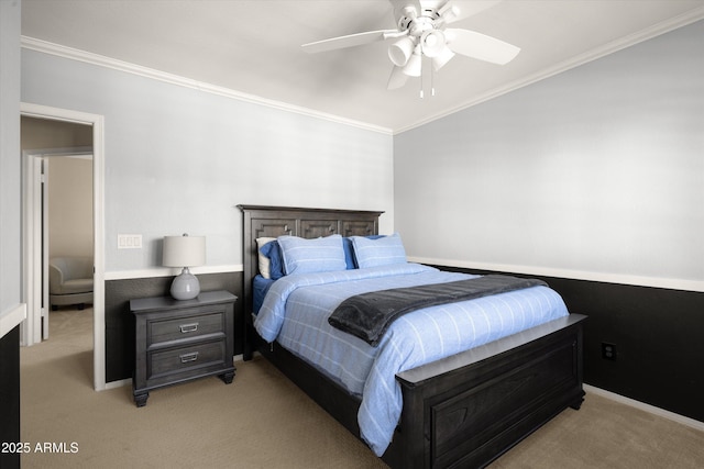 bedroom featuring ceiling fan, crown molding, and light colored carpet