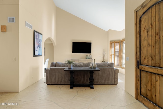 living room featuring lofted ceiling