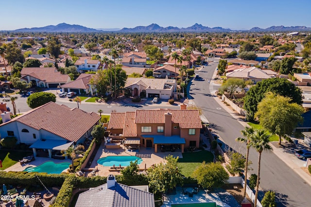 birds eye view of property with a mountain view