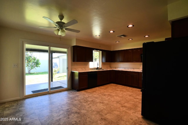 kitchen with black appliances, dark brown cabinets, ceiling fan, and sink