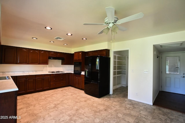 kitchen featuring ceiling fan, dark brown cabinets, and black appliances