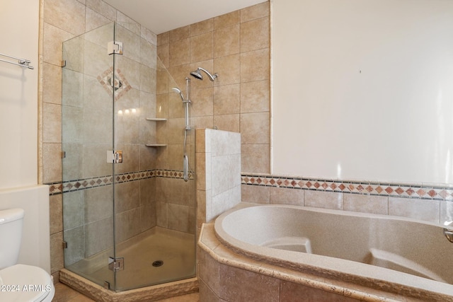 bathroom with separate shower and tub and toilet