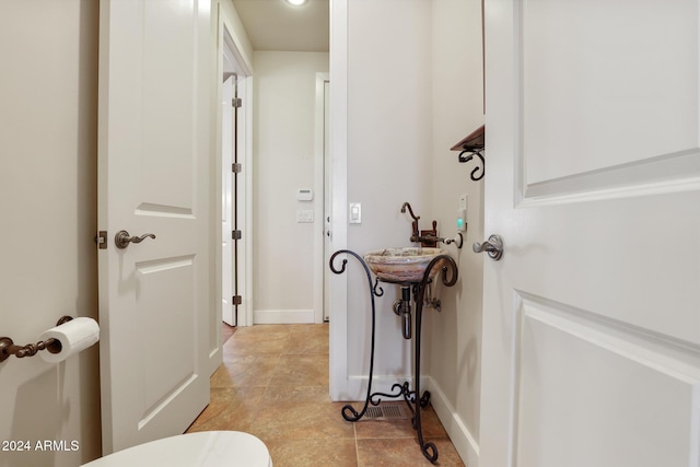 bathroom with tile patterned flooring