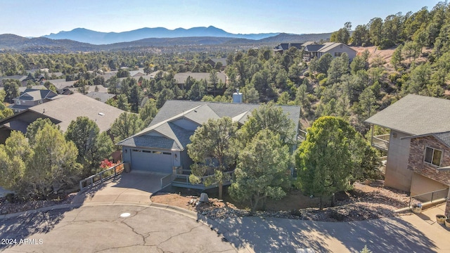 birds eye view of property featuring a mountain view