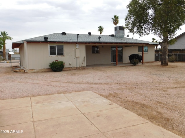 1019 E Granada Ave, Apache Junction, AZ 85119 - back of property with a patio area and cooling unit