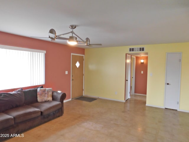 1019 E Granada Ave, Apache Junction, AZ 85119 - living room featuring baseboards and a ceiling fan