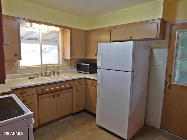 1019 E Granada Ave, Apache Junction, AZ 85119 - kitchen featuring white appliances, light countertops, a sink, tasteful backsplash, and light flooring