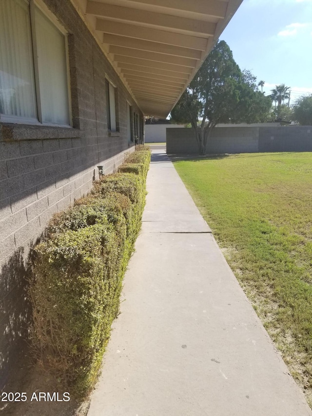 exterior space featuring a yard and fence