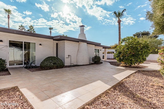 view of home's exterior featuring a patio area