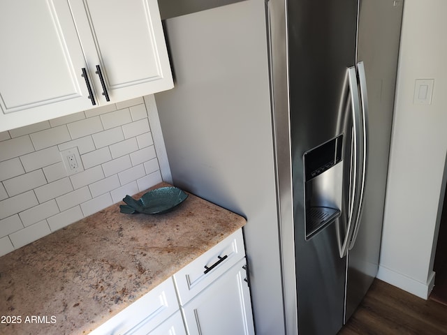 309 W Az Highway 177, Winkelman, AZ 85192 - kitchen featuring stainless steel refrigerator with ice dispenser, white cabinets, dark wood-style flooring, light stone countertops, and decorative backsplash
