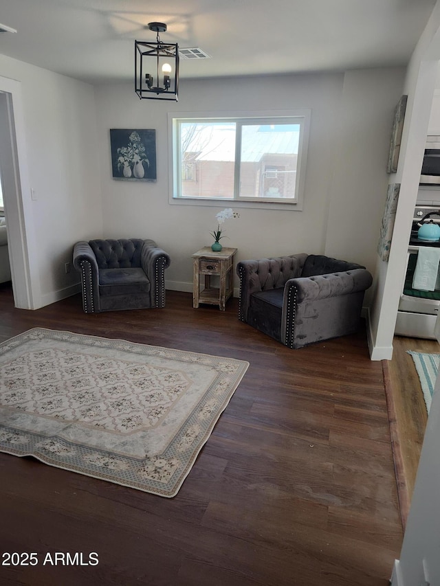 309 W Az Highway 177, Winkelman, AZ 85192 - sitting room featuring a chandelier, wood finished floors, and baseboards