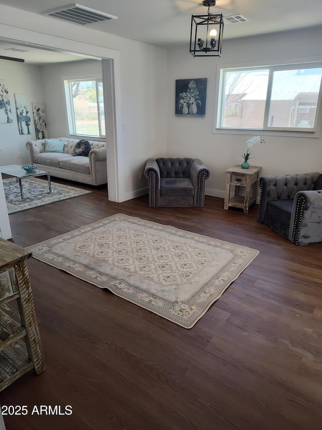 309 W Az Highway 177, Winkelman, AZ 85192 - living room with a chandelier, wood finished floors, and baseboards