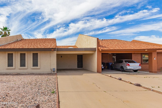 view of front of home with a carport