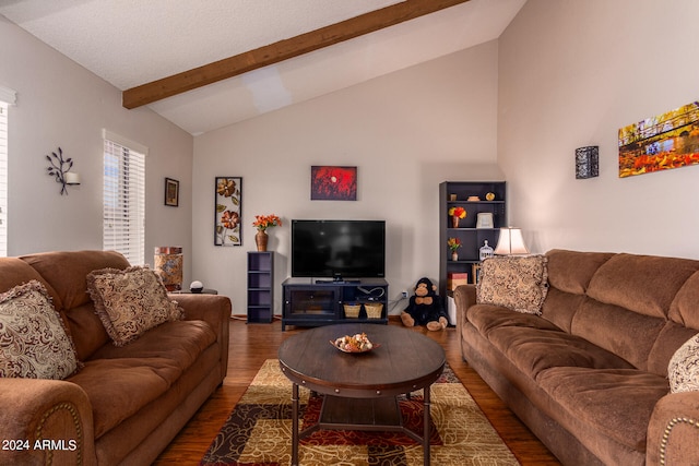 living room with lofted ceiling with beams and hardwood / wood-style floors