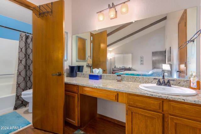 full bathroom with lofted ceiling with beams, shower / tub combo, hardwood / wood-style floors, toilet, and vanity