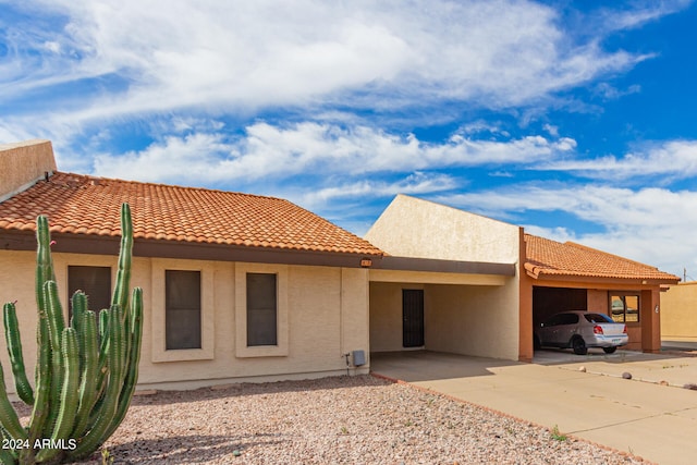 exterior space featuring a carport