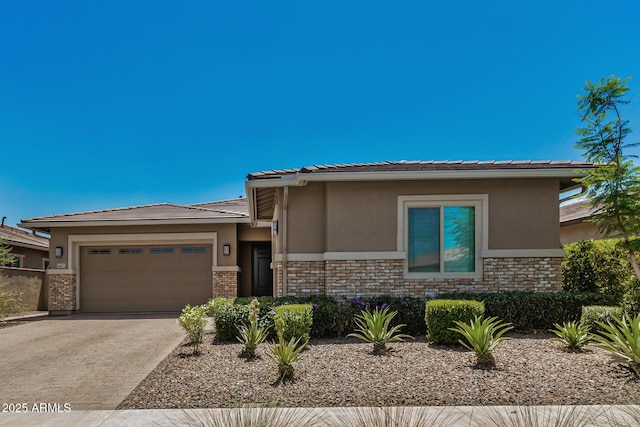 14571 W Wethersfield Rd, Surprise, AZ 85379 - prairie-style home featuring stucco siding, a garage, and brick siding