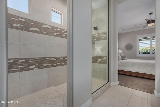 14571 W Wethersfield Rd, Surprise, AZ 85379 - ensuite bathroom with healthy amount of natural light, tile patterned floors, a tile shower, and a ceiling fan