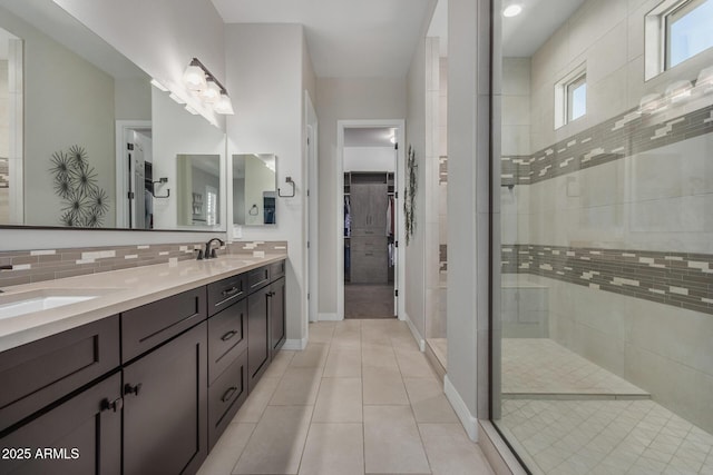 14571 W Wethersfield Rd, Surprise, AZ 85379 - full bath with walk in shower, tile patterned flooring, double vanity, and a walk in closet