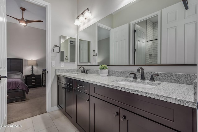 14571 W Wethersfield Rd, Surprise, AZ 85379 - ensuite bathroom featuring a ceiling fan, baseboards, tile patterned floors, and double vanity