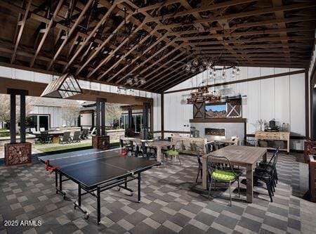 14571 W Wethersfield Rd, Surprise, AZ 85379 - recreation room with exterior fireplace and vaulted ceiling