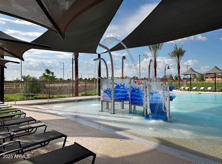14571 W Wethersfield Rd, Surprise, AZ 85379 - view of playground with fence and a community pool