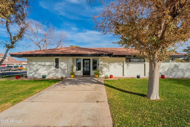 ranch-style house with a front lawn