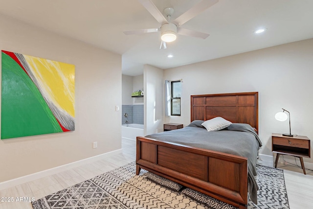 bedroom featuring ensuite bath and ceiling fan