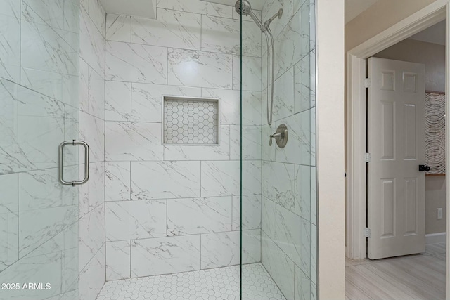 bathroom featuring an enclosed shower