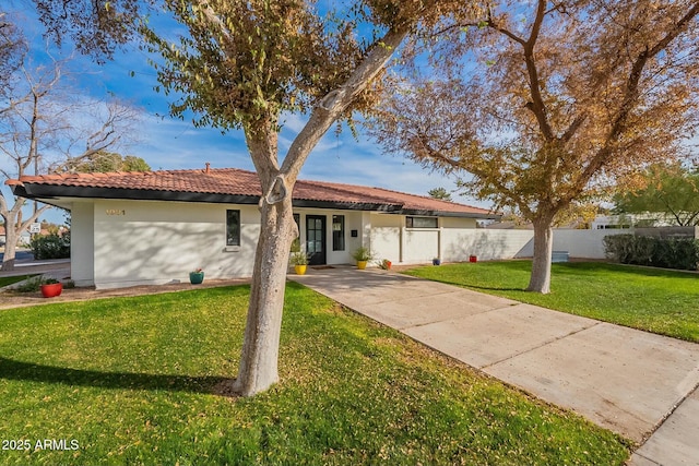 ranch-style house with a front lawn