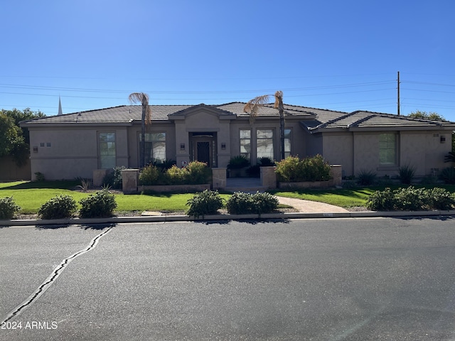 view of front facade with a front yard