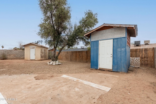 view of shed with a fenced backyard