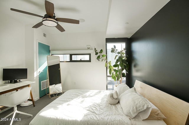 bedroom featuring dark carpet and ceiling fan