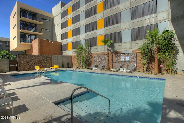 view of swimming pool featuring a patio area