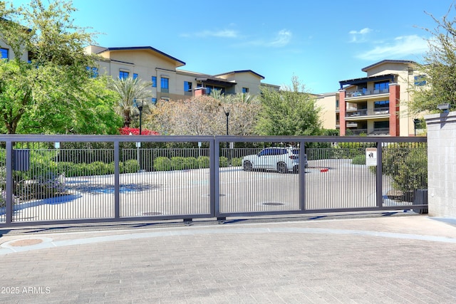 view of gate with fence