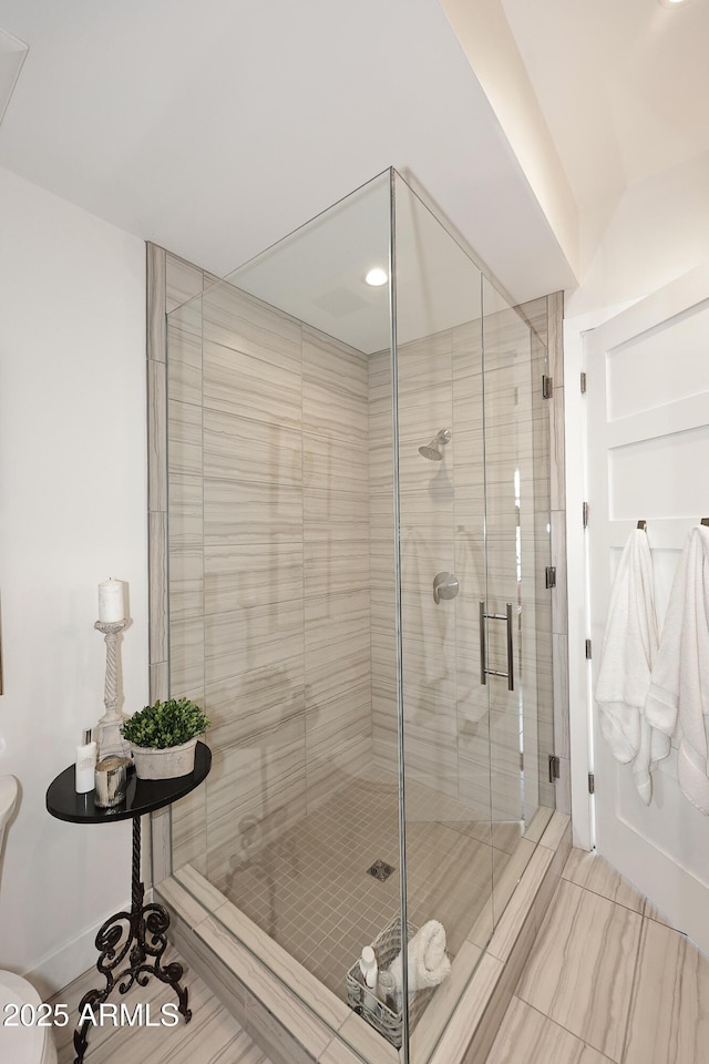 bathroom with a shower stall