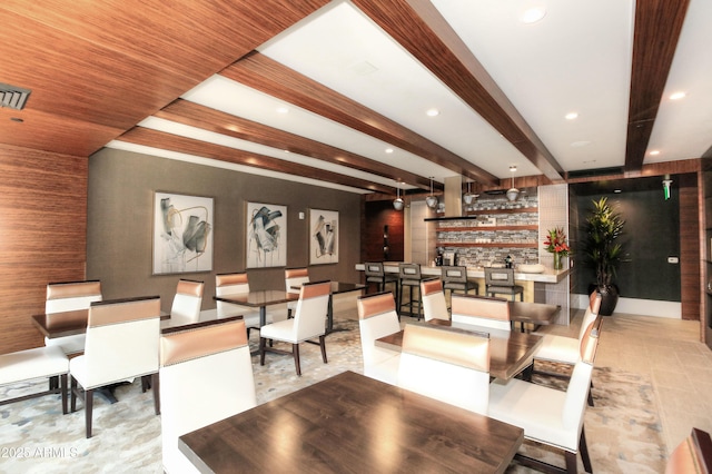 dining room featuring visible vents, baseboards, beamed ceiling, a community bar, and recessed lighting