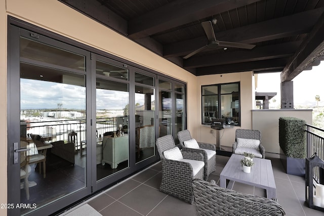 balcony with french doors, a ceiling fan, and outdoor lounge area