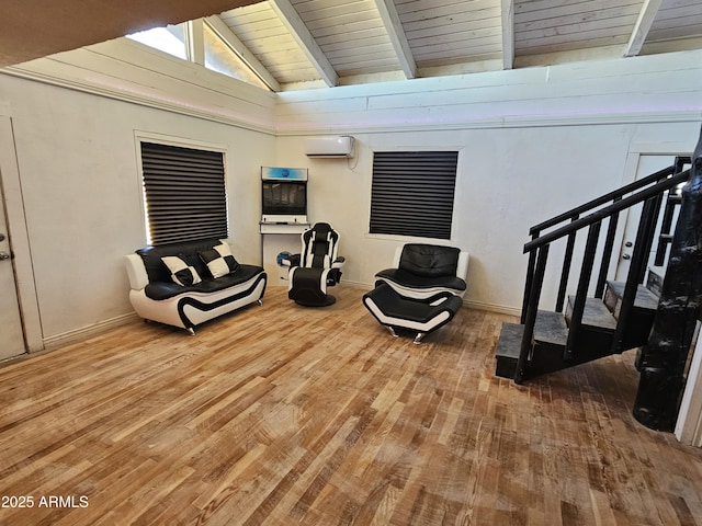 living area featuring lofted ceiling with beams, hardwood / wood-style floors, a wall mounted AC, and wood ceiling