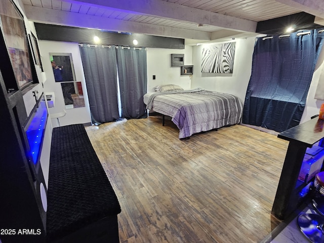 bedroom featuring wood ceiling, beam ceiling, and hardwood / wood-style floors