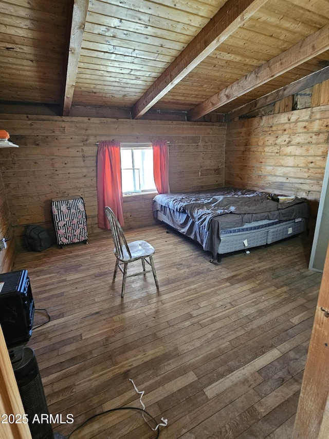 unfurnished bedroom with dark hardwood / wood-style flooring, beam ceiling, wooden ceiling, and wood walls